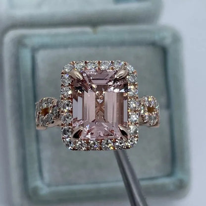Rose gold electroplated geometric alloy ring on a white background.
