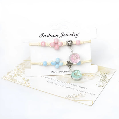 Hand-woven glass bracelet with large 1.4 cm beads containing real dried flowers, shown in blue.
