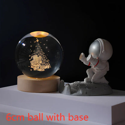 3D crystal ball night light projecting solar system pattern on wooden base with astronaut figurine