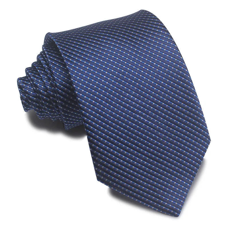 Close-up of a red and black striped jacquard weave tie with an arrow tip, showing texture.