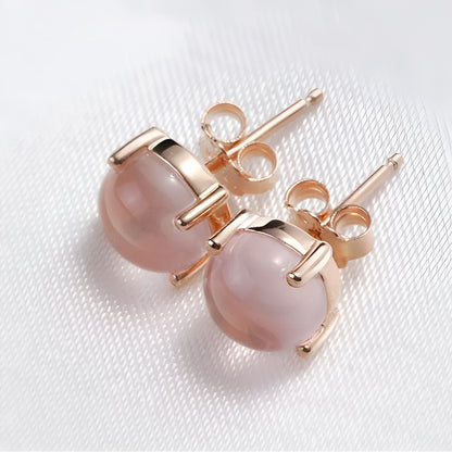 Women's drop-shaped stud earrings with synthetic rose quartz inlay and rose gold plating.