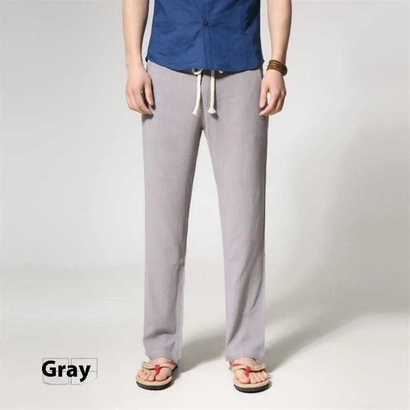 Men's straight leg casual trousers in cotton linen blend fabric showing loose fit and zip fly closure