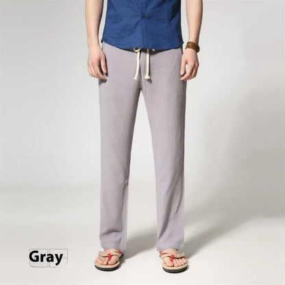 Men's straight leg casual trousers in cotton linen blend fabric showing loose fit and zip fly closure