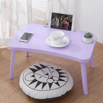 Foldable bed table in Nordic colors for portable computing