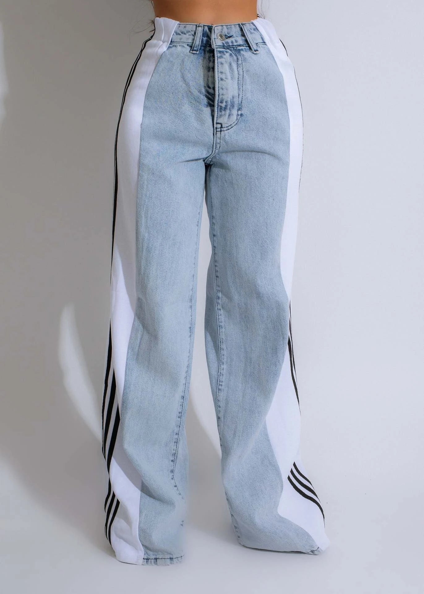 Stylish high-waist denim trousers with patchwork design, available in various color options
