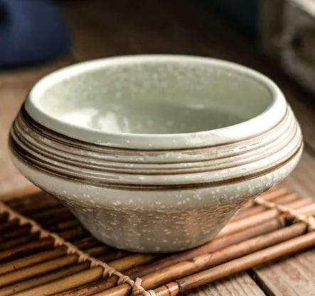 A tall porcelain soup bowl with a Japanese-inspired underglaze pattern, suitable for noodles and microwave use.