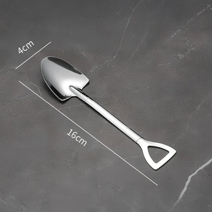 Orange ceramic Halloween pumpkin mug with cartoon face and included spoon on autumn table