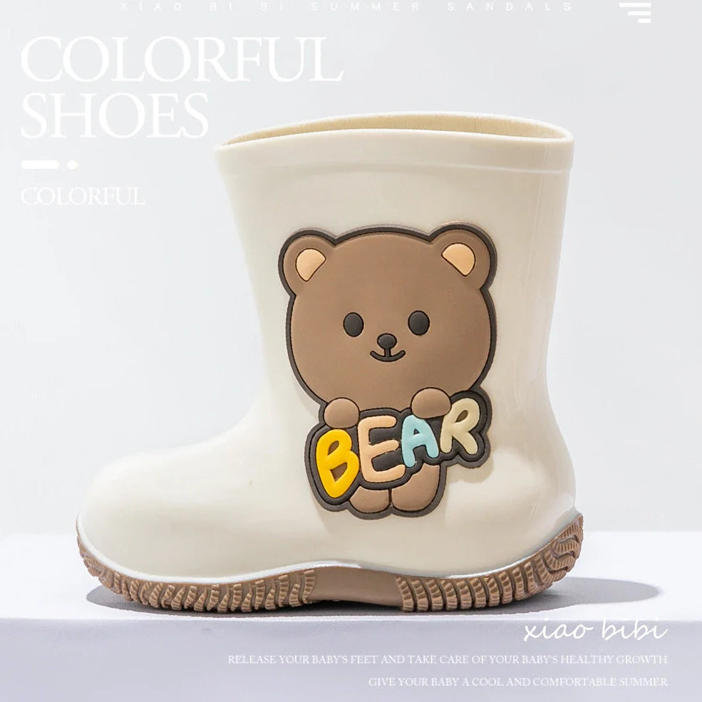 Children's PVC rain shoes with cartoon bear design showing waterproof construction and low heel