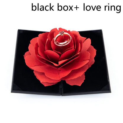 Red 3D heart-shaped plastic ring box with rose decoration on a rotating stand