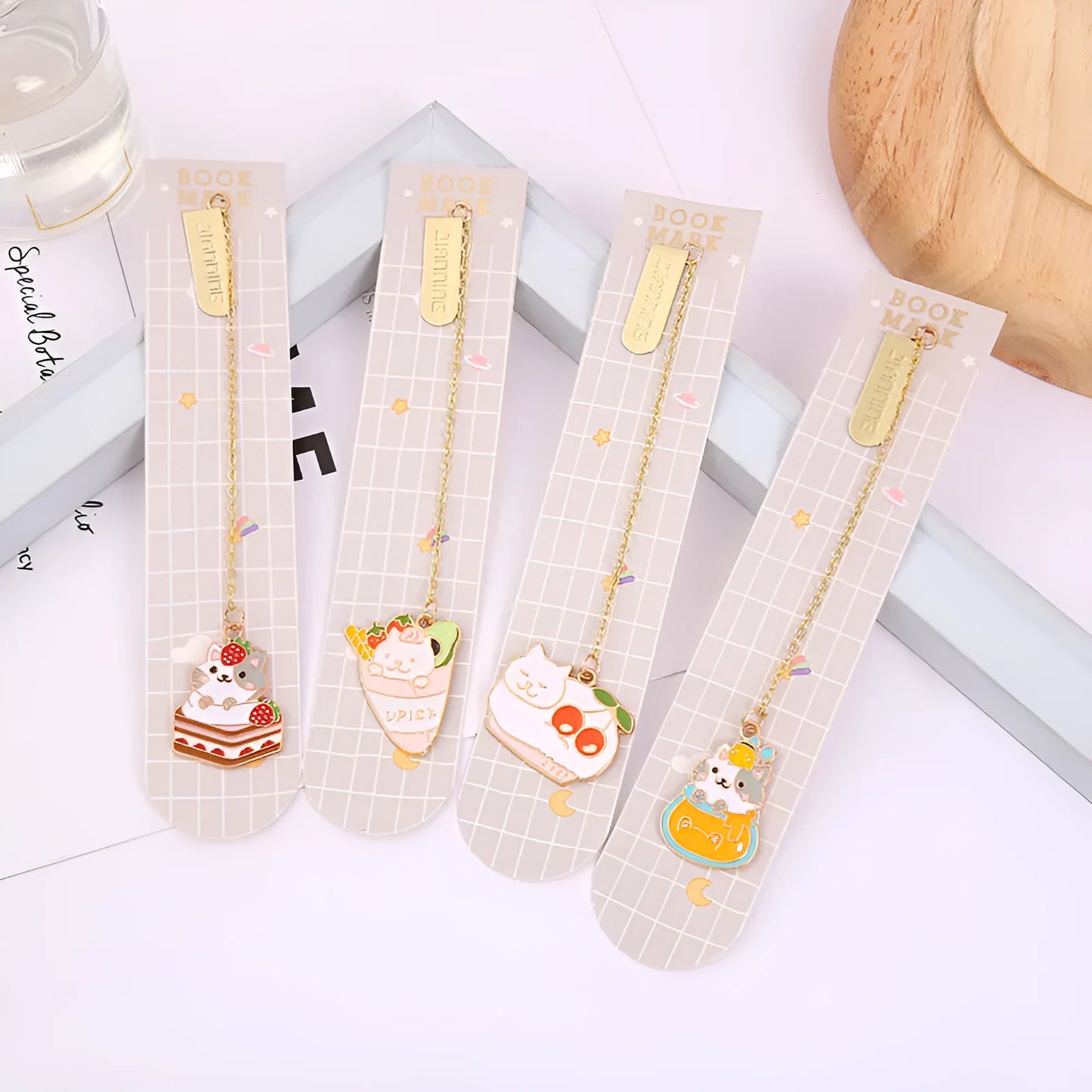 Jane Lime Foodie cat creative metal bookmark with cartoon pendant on a book page.