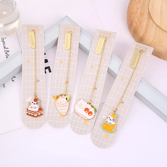 Jane Lime Foodie cat creative metal bookmark with cartoon pendant on a book page.