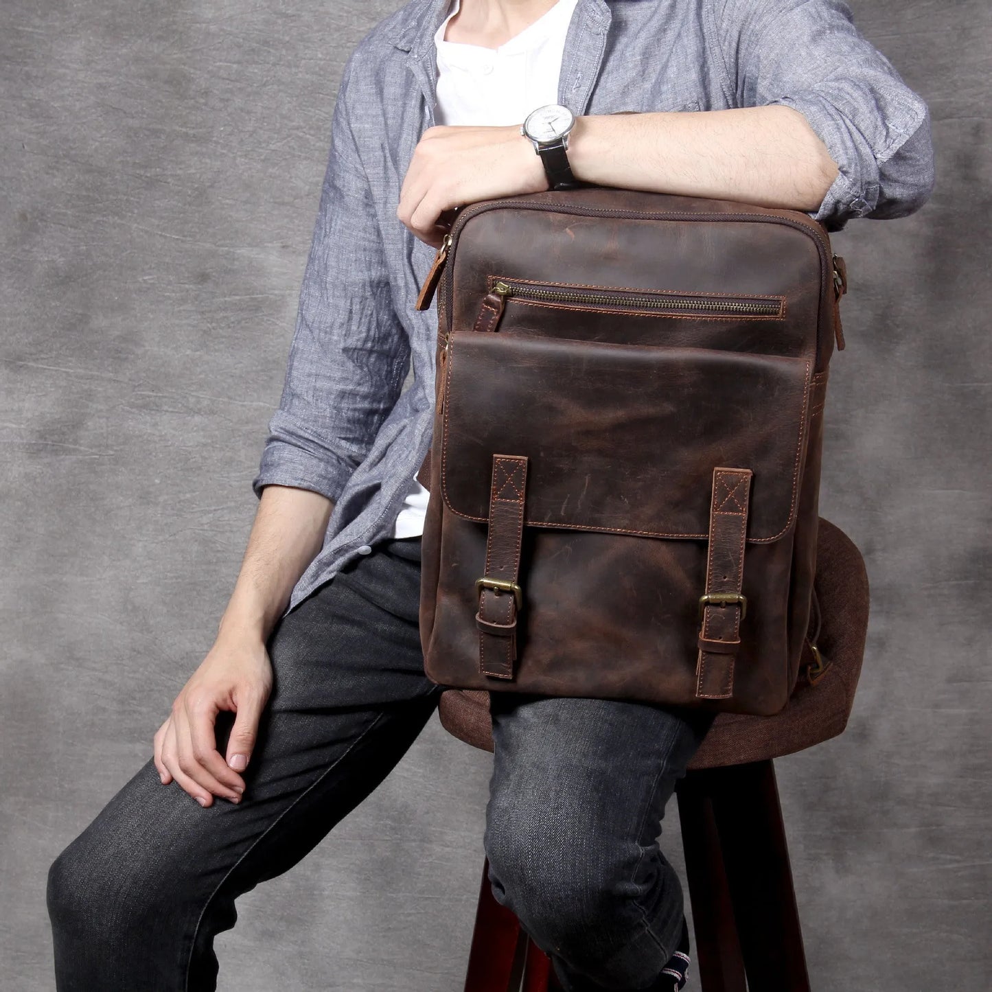 Dark coffee coloured retro leather backpack made from first layer cowhide with organised interior pockets.