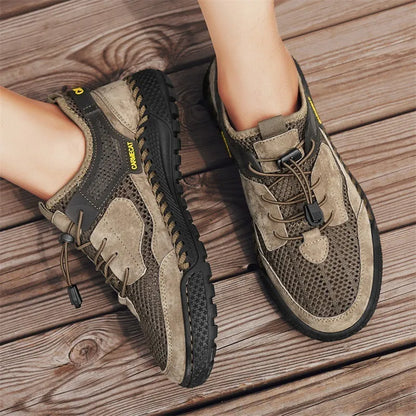 Men's brown suede casual tennis shoes with elastic band closure and hand-stitched rubber sole.