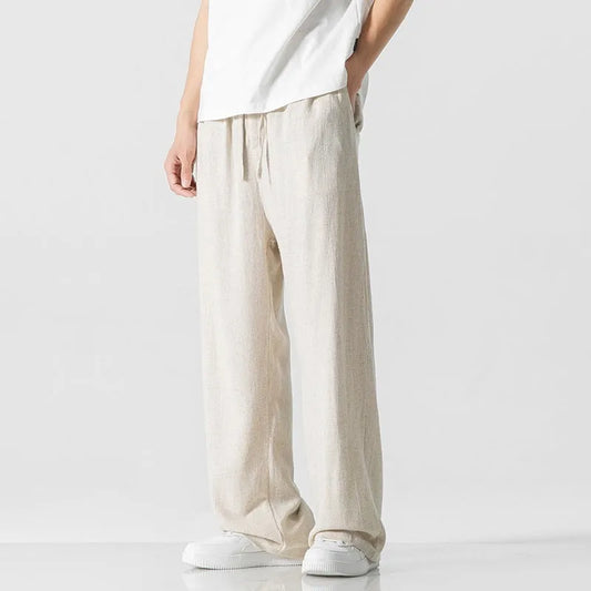 Men's bamboo fibre linen trousers in cropped length with drawstring waist, shown in a casual setting