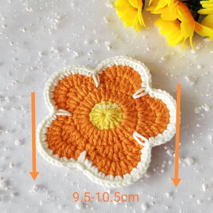 Five handmade woven flower placemats in blue, green, orange, pink and purple colours