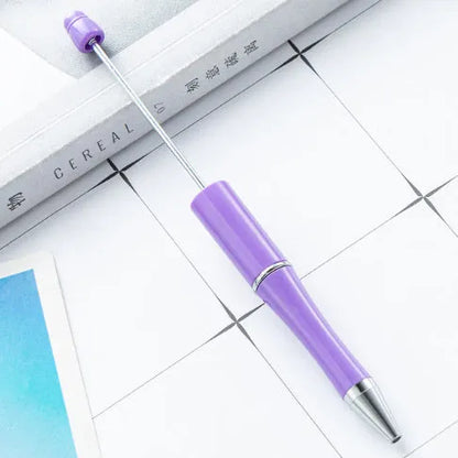 Rotating bead ballpoint pen in gradient colour with ABS plastic and steel wire construction