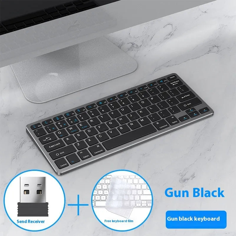 Black ultra-thin wireless keyboard and mouse combo with USB receiver and keyboard cover on a desk.
