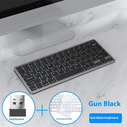 Black ultra-thin wireless keyboard and mouse combo with USB receiver and keyboard cover on a desk.