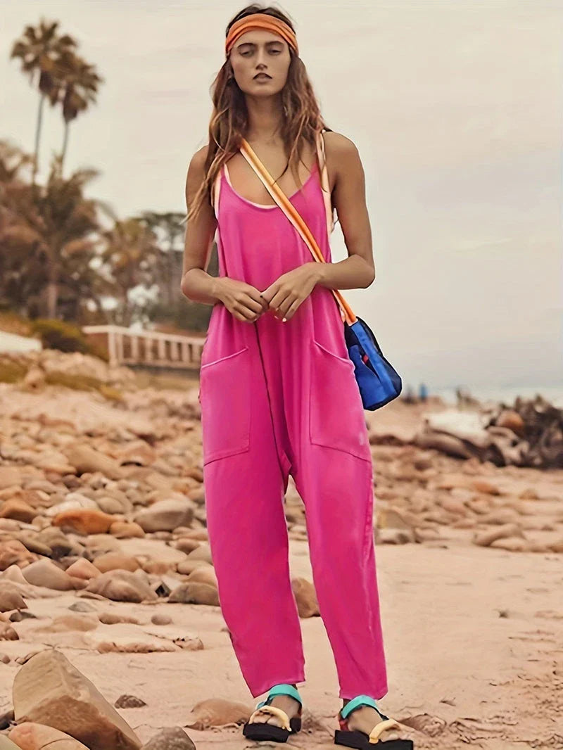 Sleeveless jumpsuit with spaghetti straps, pockets, and zipper closure in various colors
