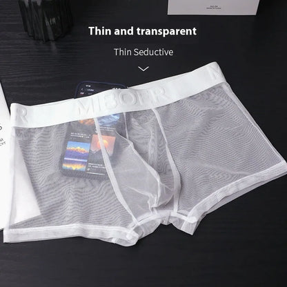 Men's thin solid colour boxer shorts in black, laid flat to show knit texture and seamless design