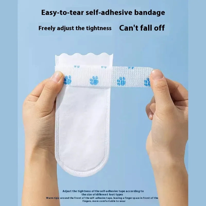 White disposable waterproof shoe covers for dogs, shown in a pack of 20.