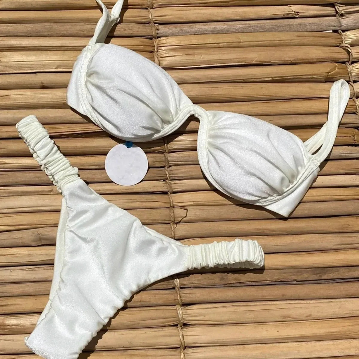 Women's underwire bikini swimsuit with split briefs design in khaki colour showing spandex lining construction