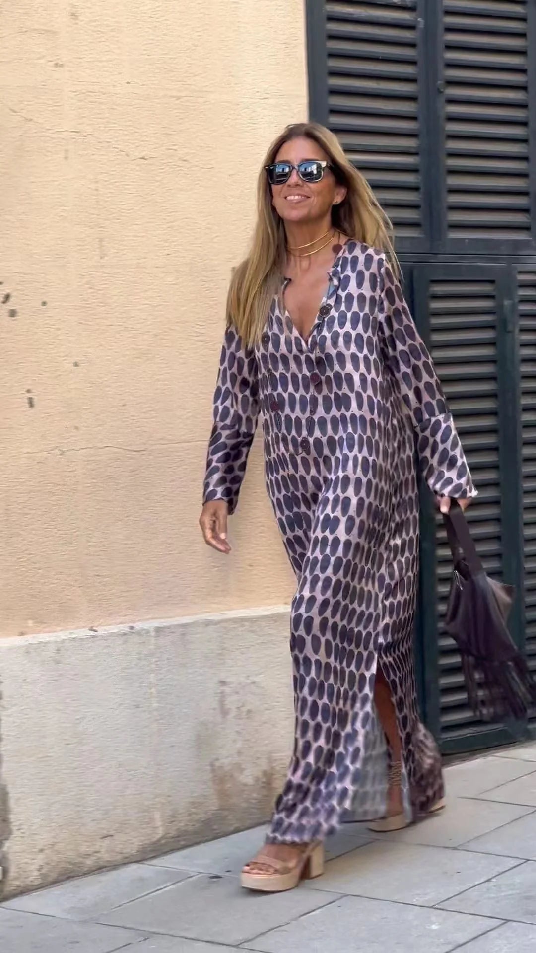 Women's geometric printed V-neck long dress with long sleeve slit, available in multiple colors and sizes.