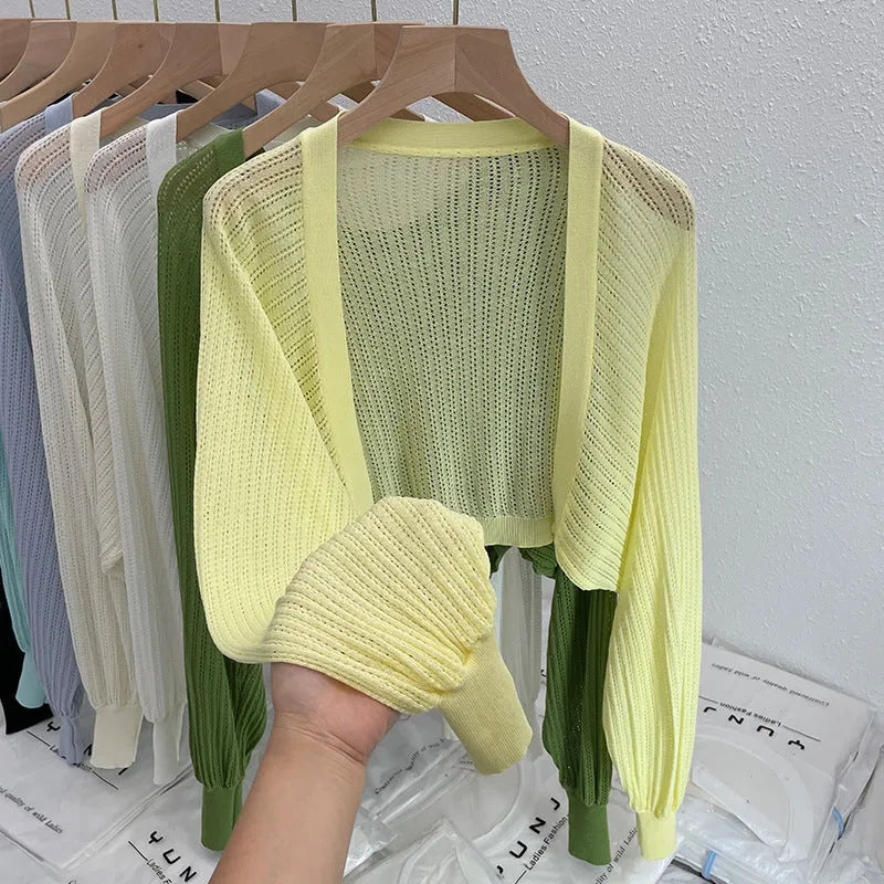 Long sleeve polyester blouse with lantern sleeves and hollow detail in apricot colour.