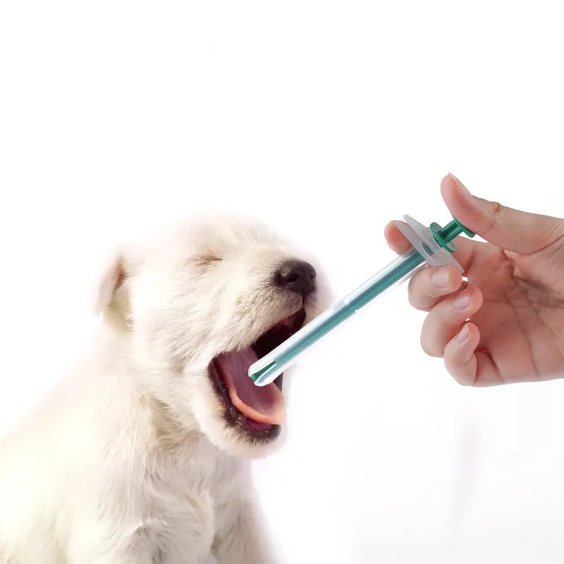 Two silicone pet pill shooters with soft tips for cat and dog medication.
