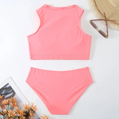 Pink high-waist split bikini swimsuit with briefs style and sleeveless design on mannequin