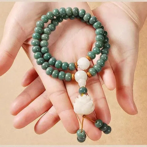 White jade bodhi and green sandalwood bracelet with a double ring safety buckle clasp.