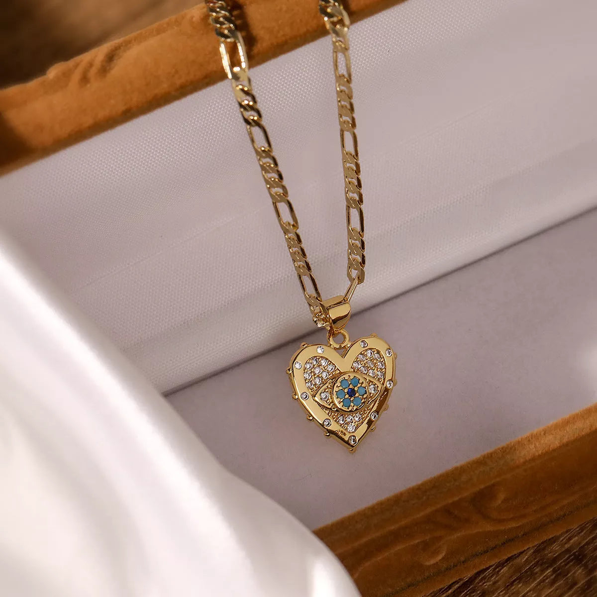 Heart-shaped zircon pendant and earrings set with copper plating and real gold accents