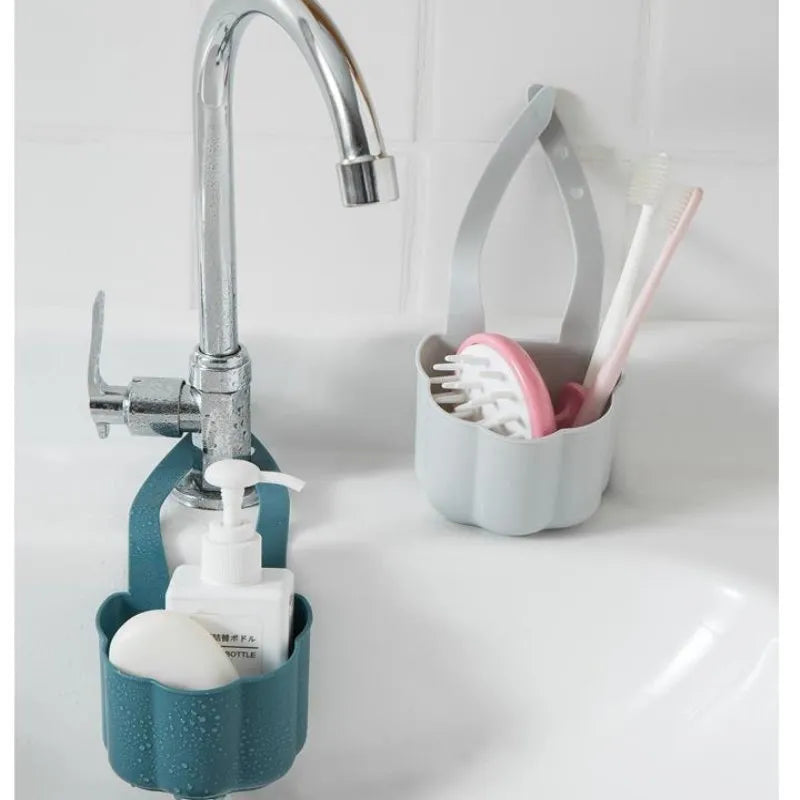 Nordic style plastic sink drain basket with draining compartment in blue, grey, or pink colour options.