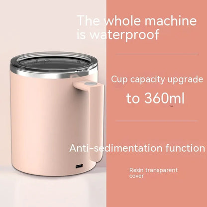 White automatic magnetic stirring coffee cup with stainless steel interior on a desk