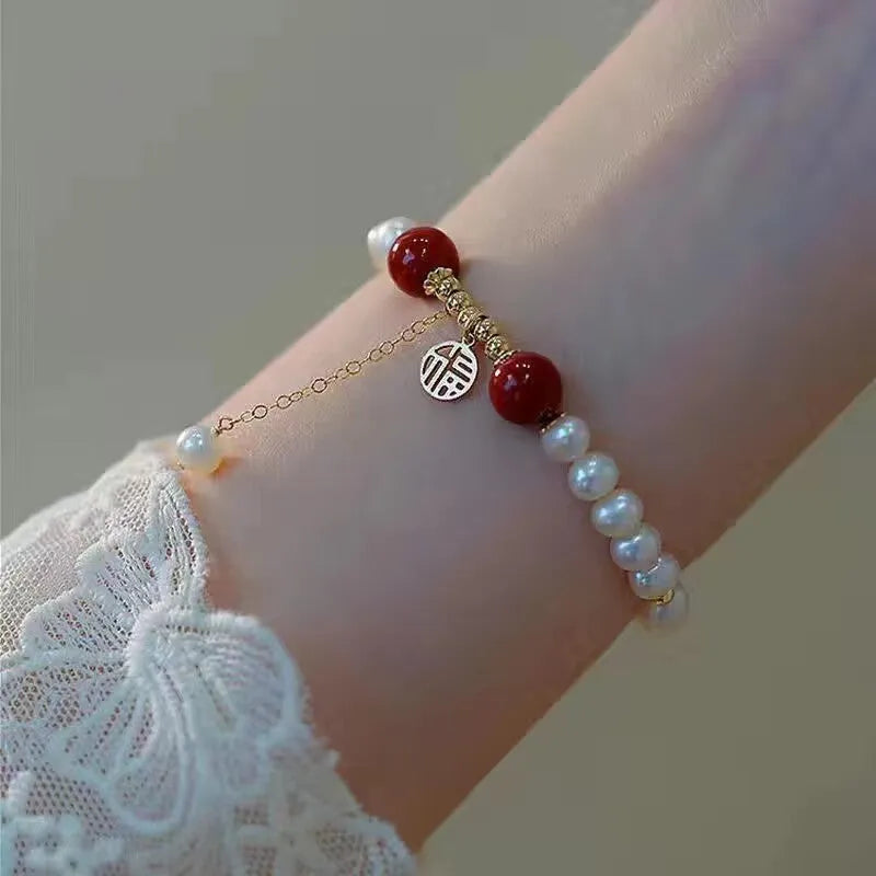 Chinese style glass bead bracelet with bamboo joint design on wrist.