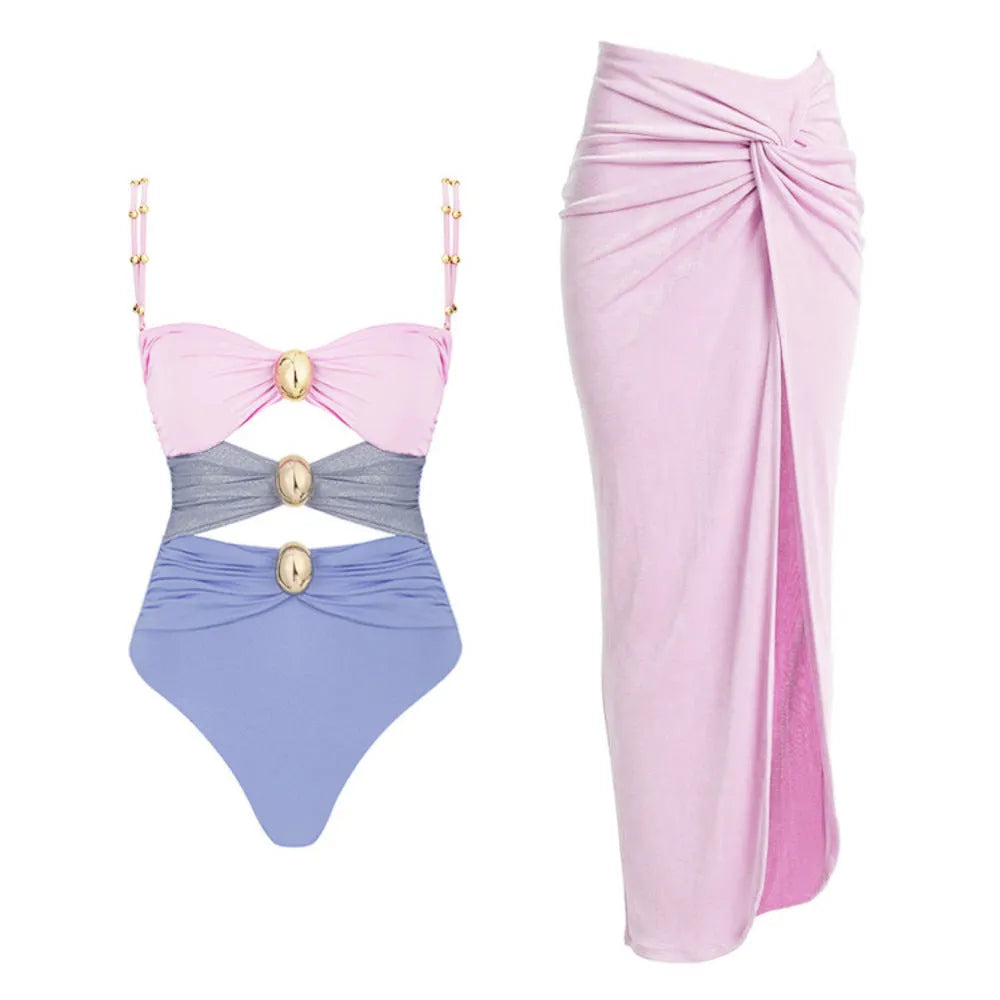 Women's green one-piece swimsuit with round buckle decoration and hollow-out stitching detail on nylon fabric.