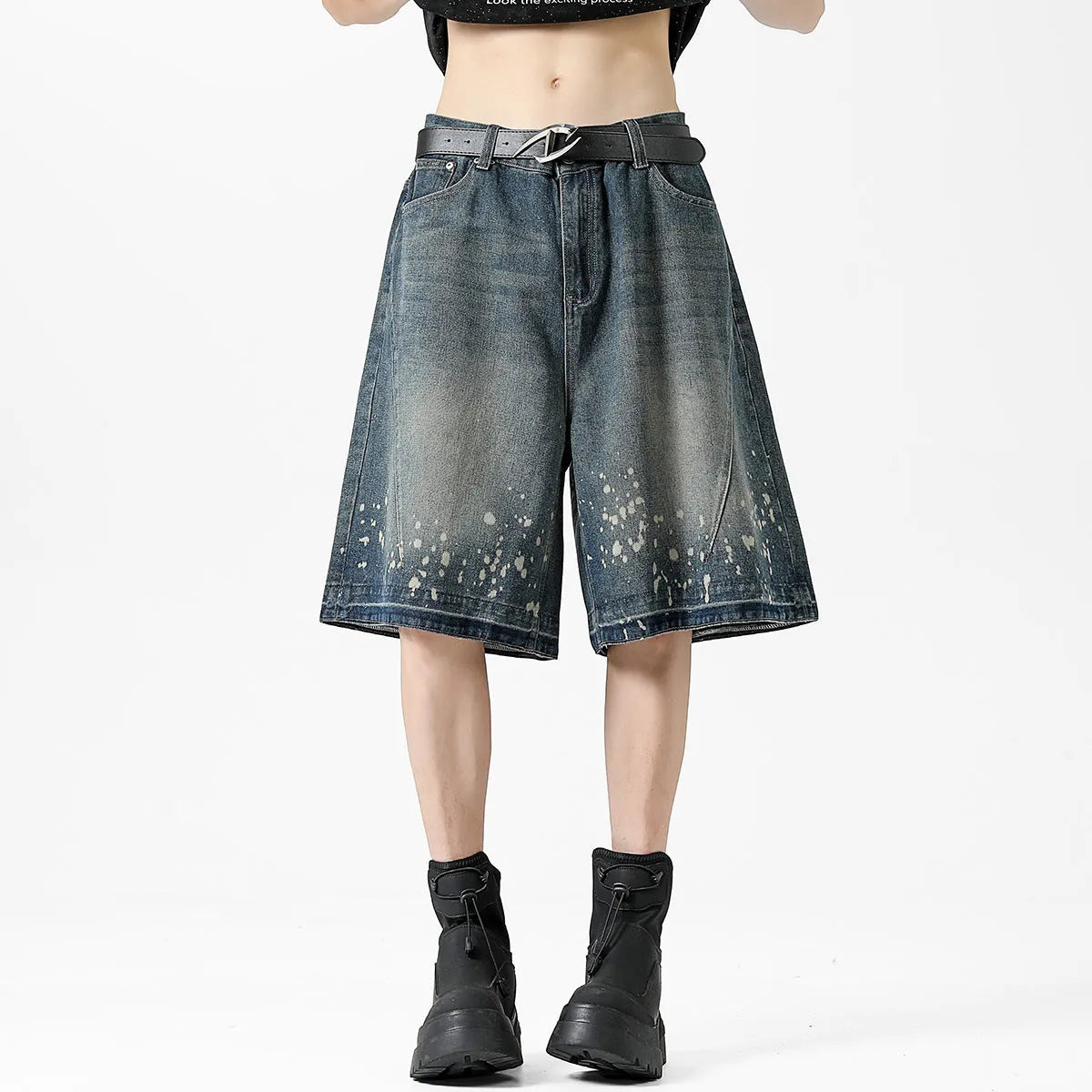 Retro blue denim shorts for men with ripped details and splash ink pattern on a straight cut.