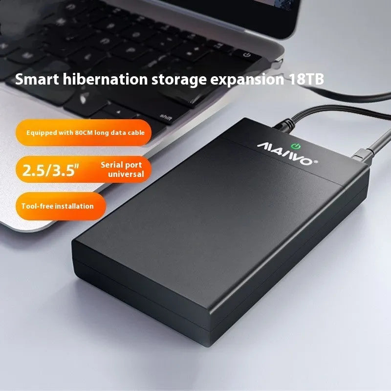 Black and silver 3.5-inch SATA hard disk enclosure with slide-open cover, USB 3.0 cable, and power adapter.
