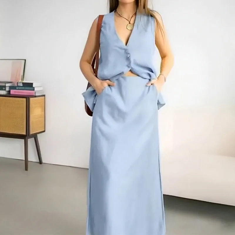 Women's casual two-piece suit with sleeveless vest and long skirt in blue colour, showing loose fit design