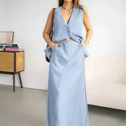 Women's casual two-piece suit with sleeveless vest and long skirt in blue colour, showing loose fit design