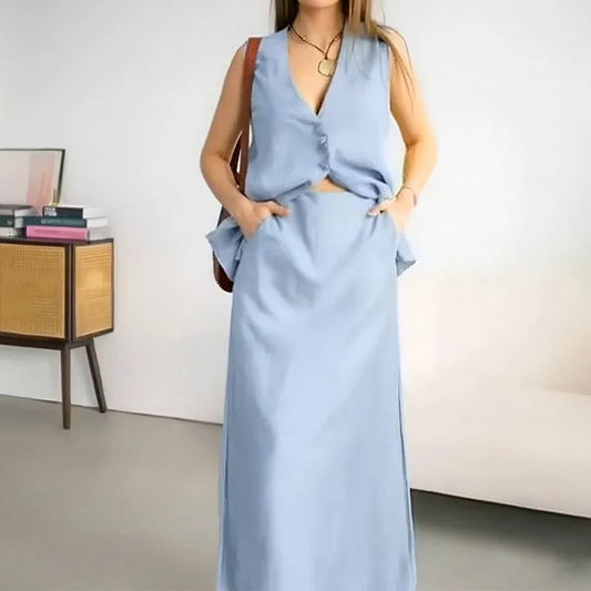 Women's casual two-piece suit with sleeveless vest and long skirt in blue colour, showing loose fit design