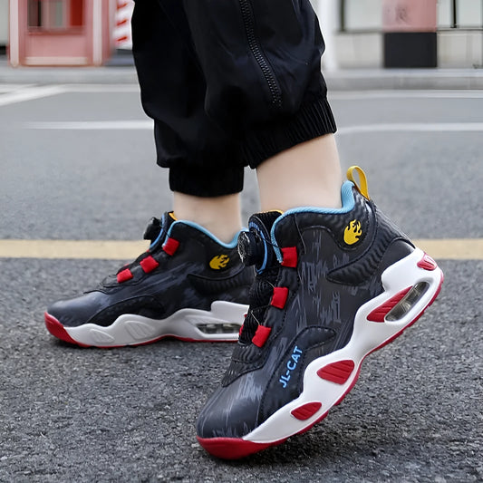 Children's rotating button running shoes in black with PU sole and synthetic leather upper, showing button closure mechanism