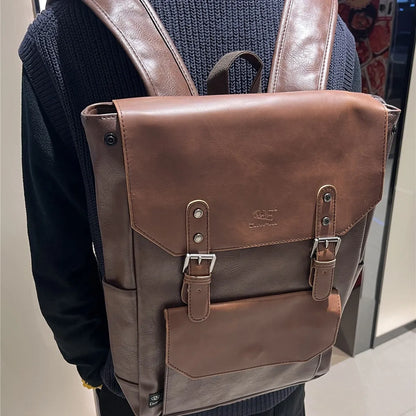Unisex large capacity PU backpack in a solid colour, shown in college style.