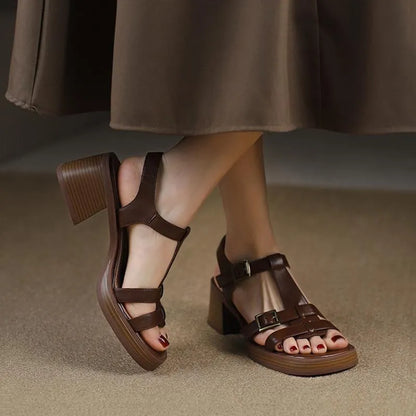 Black women's retro sandals with T-buckle, chunky heel, and open square toe.