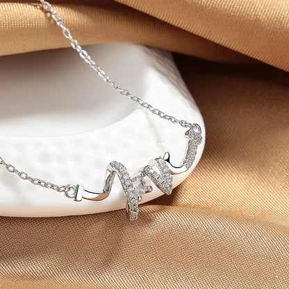 Elegant LOVE Necklace for Women in silver and gold, featuring a delicate O-shaped chain and LOVE pendant.