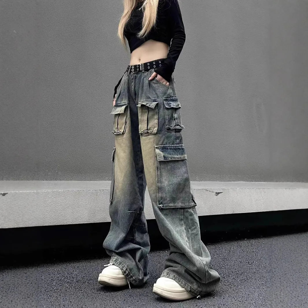 Loose multi-pocket distressed denim pants in light blue and black on a size chart.