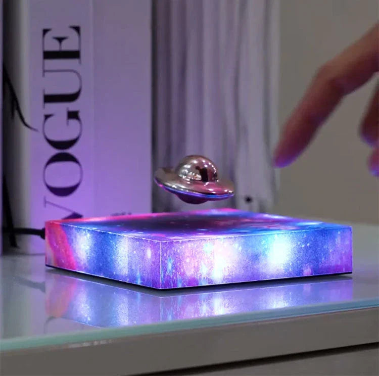 Levitating UFO Galaxy Lamp with color-changing RGB lighting, magnetic suspension, and a glowing galaxy base