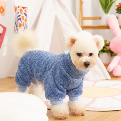 Blue double-sided plush four-legged dog clothing with high collar and towing ring laid flat.