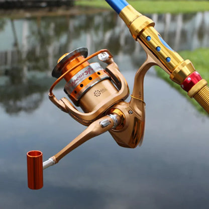 Orange Metal Head Rocker Fishing Reel with interchangeable handle for versatile use