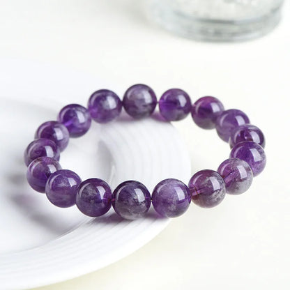 Natural feather amethyst bracelet with scattered purple crystal beads and Ruyi elements on wrist